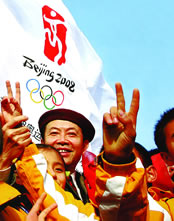 Yuan in front of 2008 Olympic flag